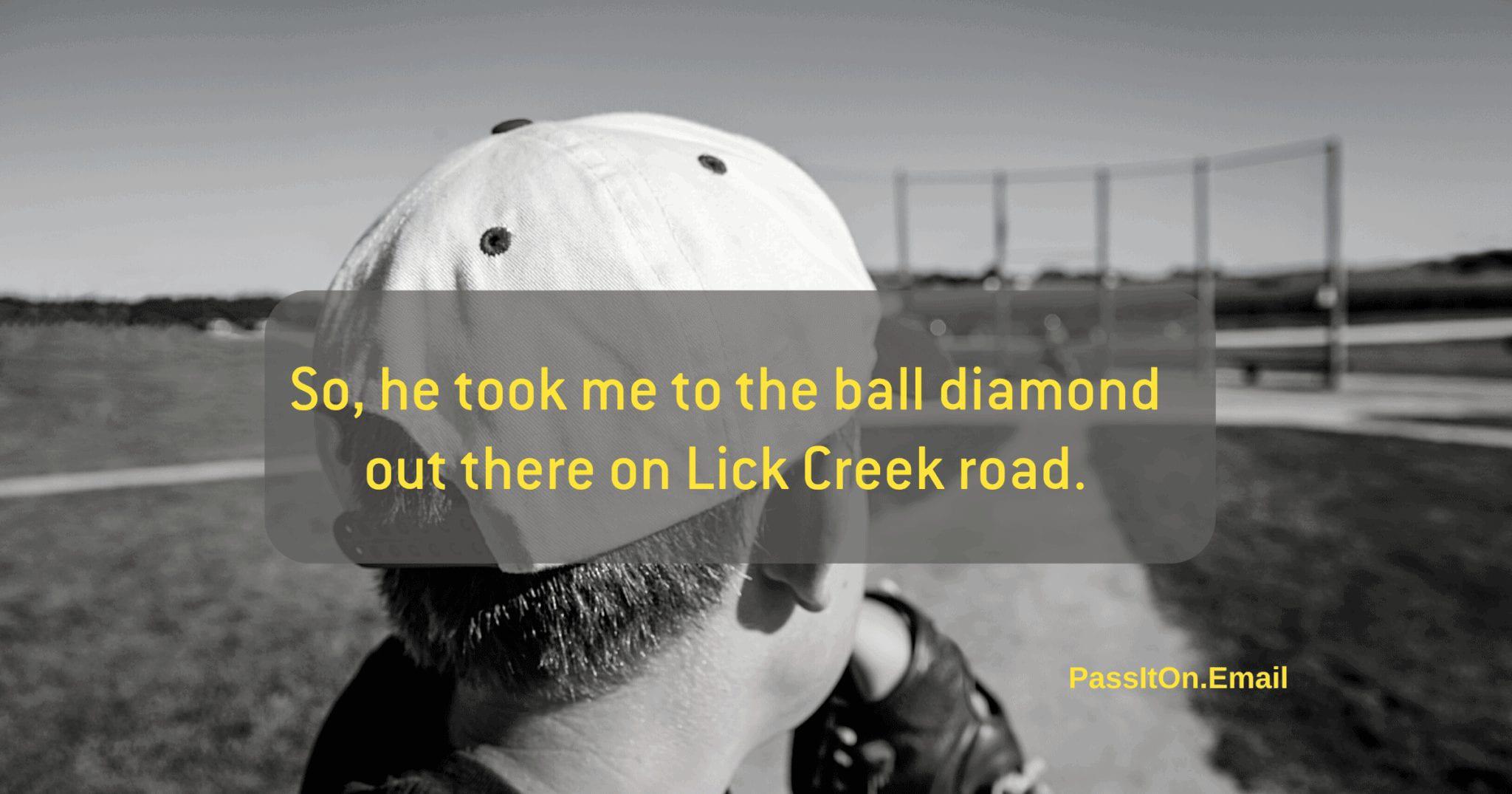 black and white image of child with baseball hat on