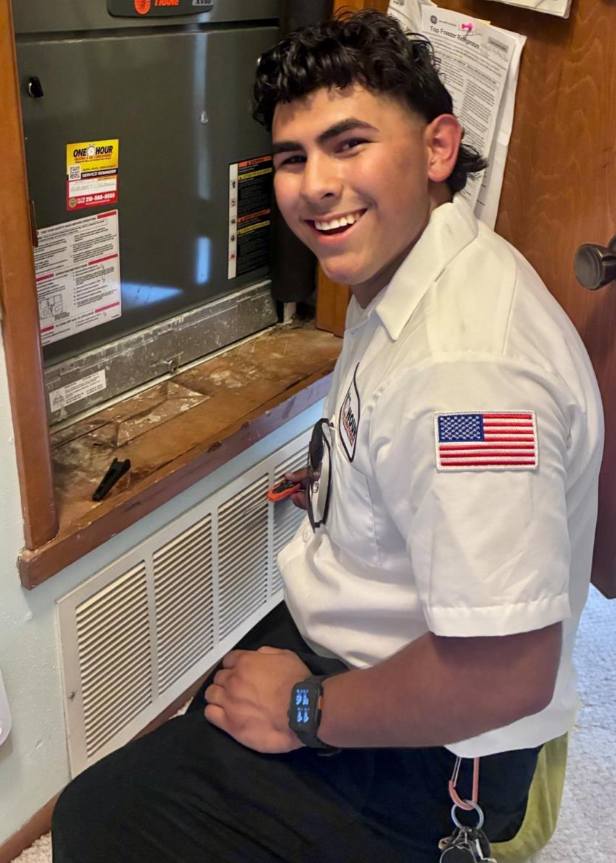 A smiling technician