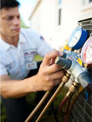 man performing ac tuneup