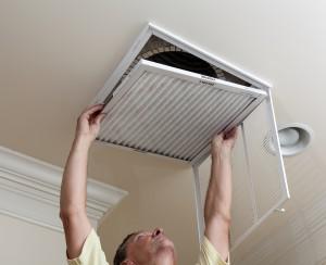 Man removing air filter