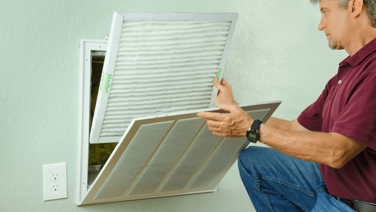 Man changing air filter