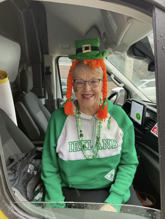 A picture of staff at a St. Patrick's day parade 