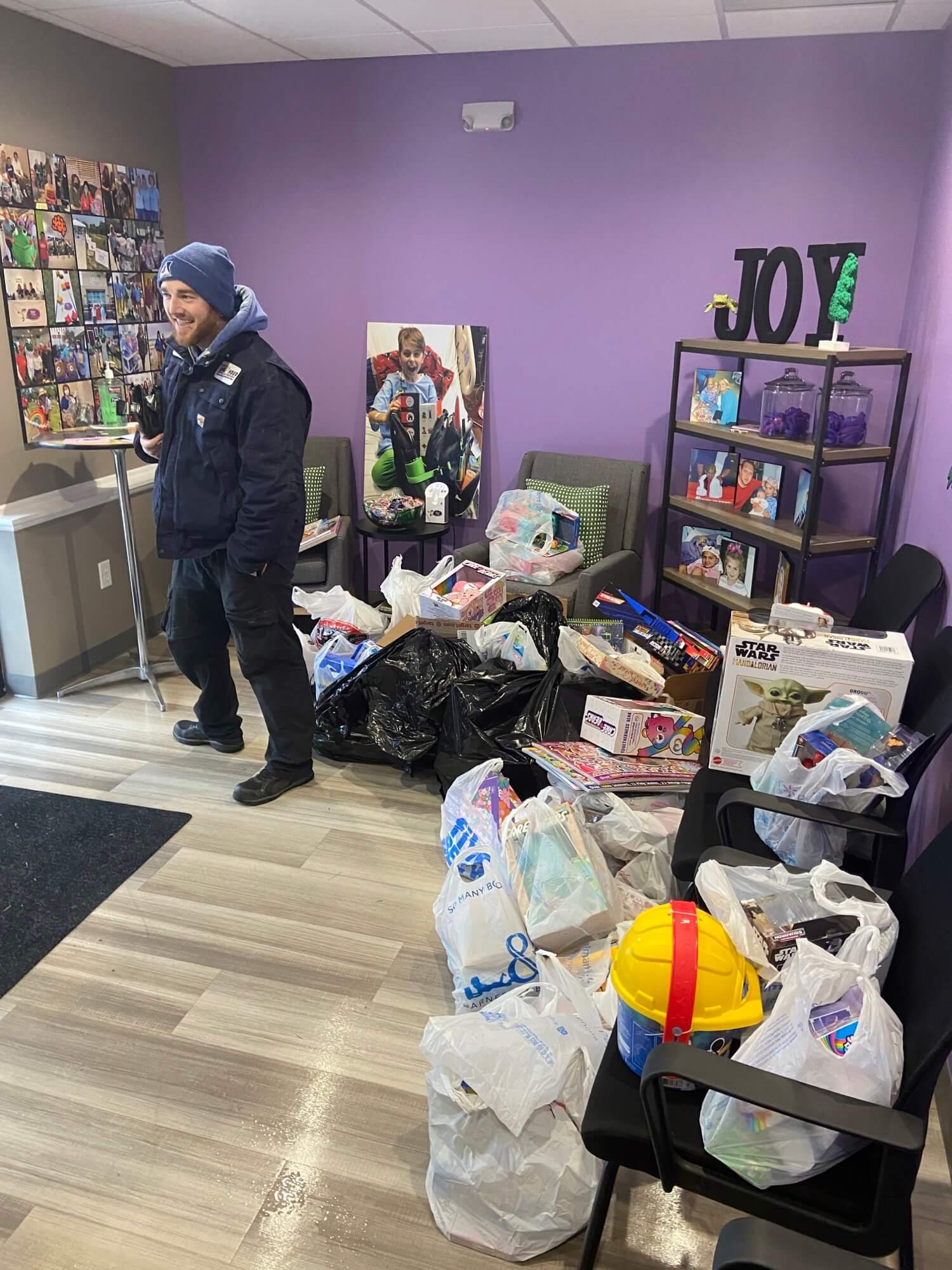 Employee with bags of toys 