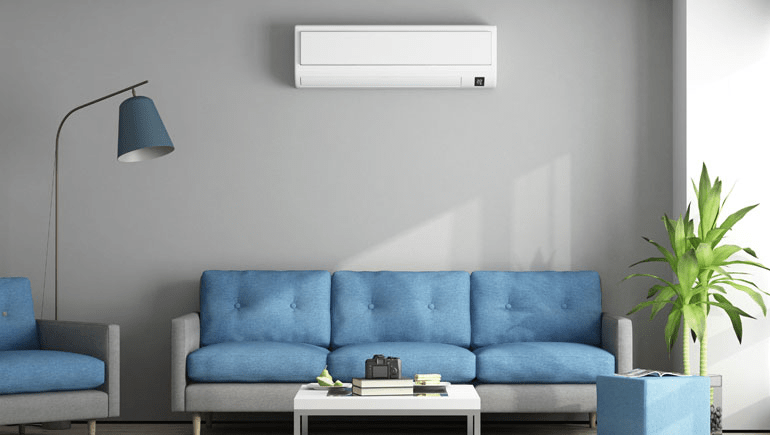 Ductless AC Unit over blue couch