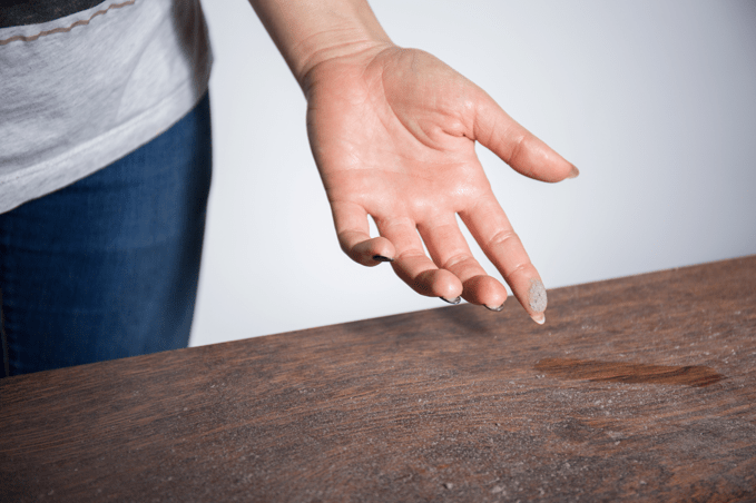 Dust On Womans Finger