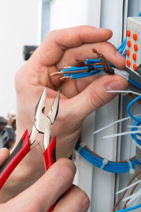 Person cutting electrical wires