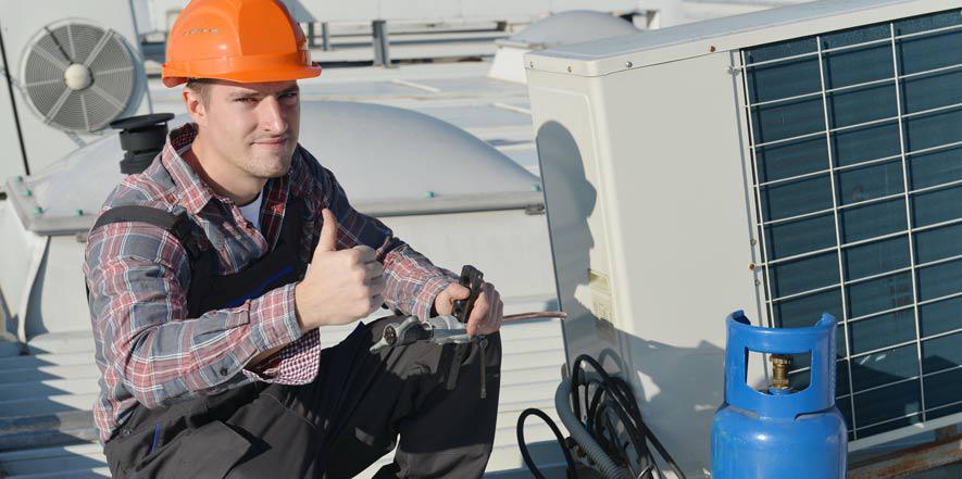 a hvac technician repairing a heating system