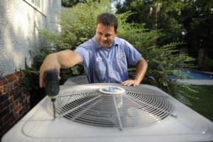 man fixing an air conditioner 