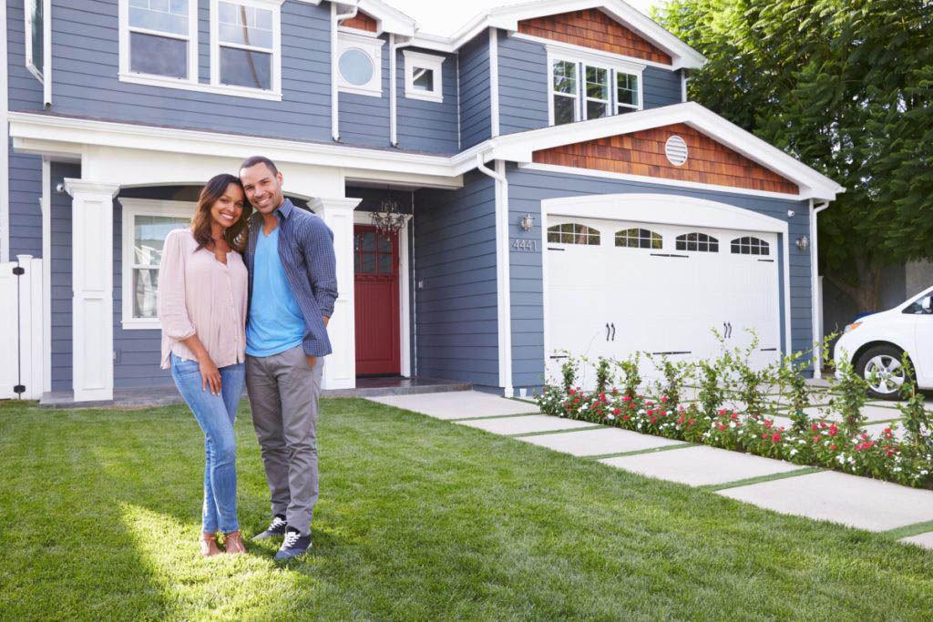 couple in front of home