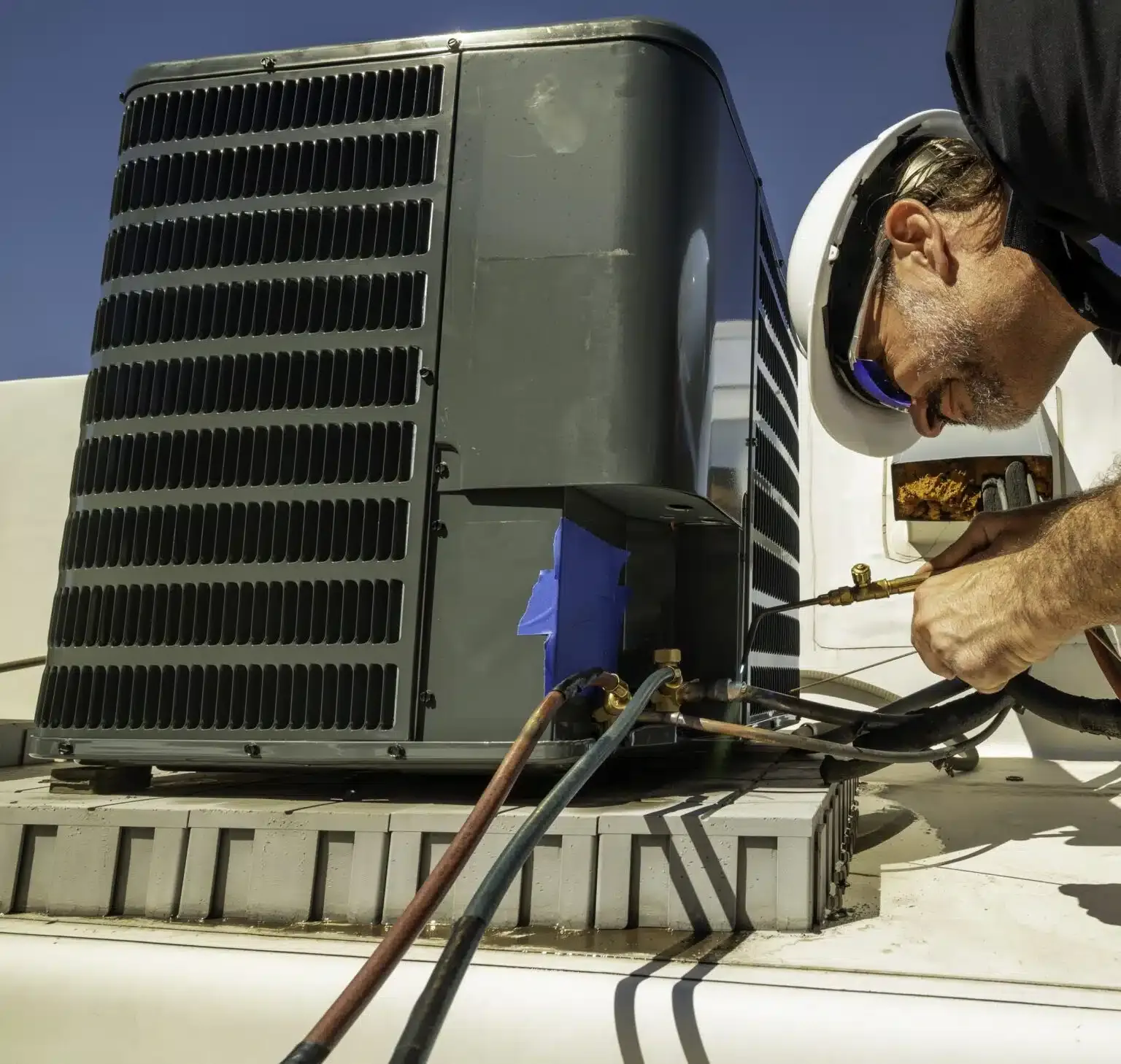 technician working on outdoor unit