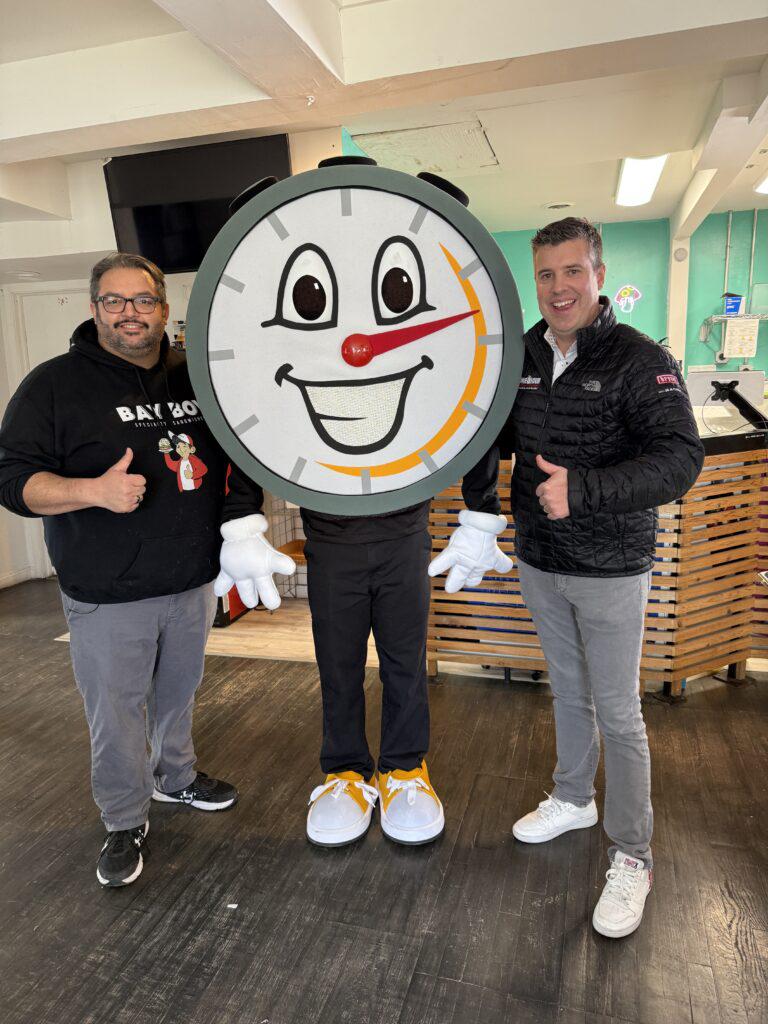 One Hour team members with One Hour Heating and Air Conditioning mascot