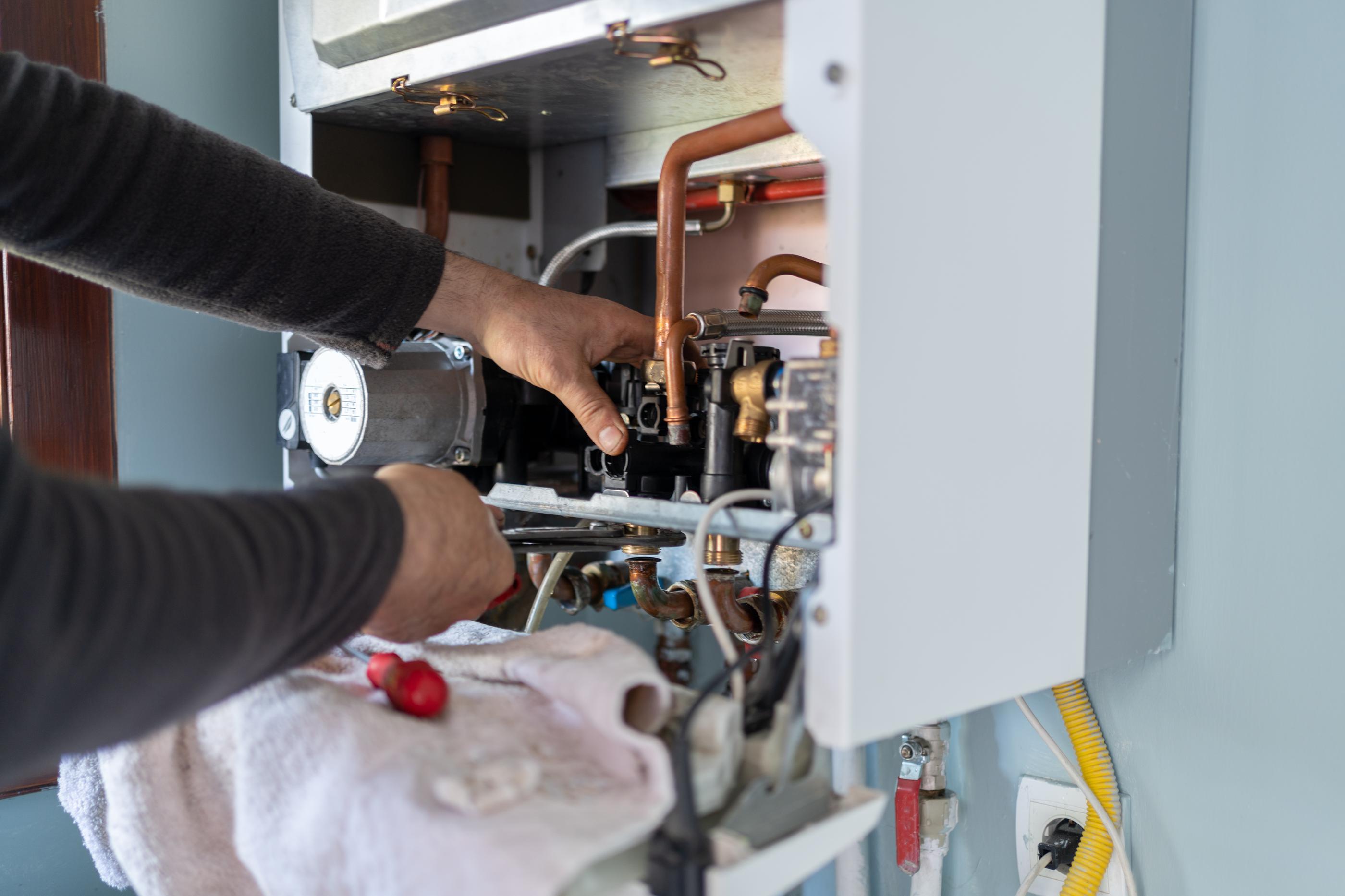 person repairing furnace
