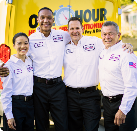 One Hour team standing in front of work van