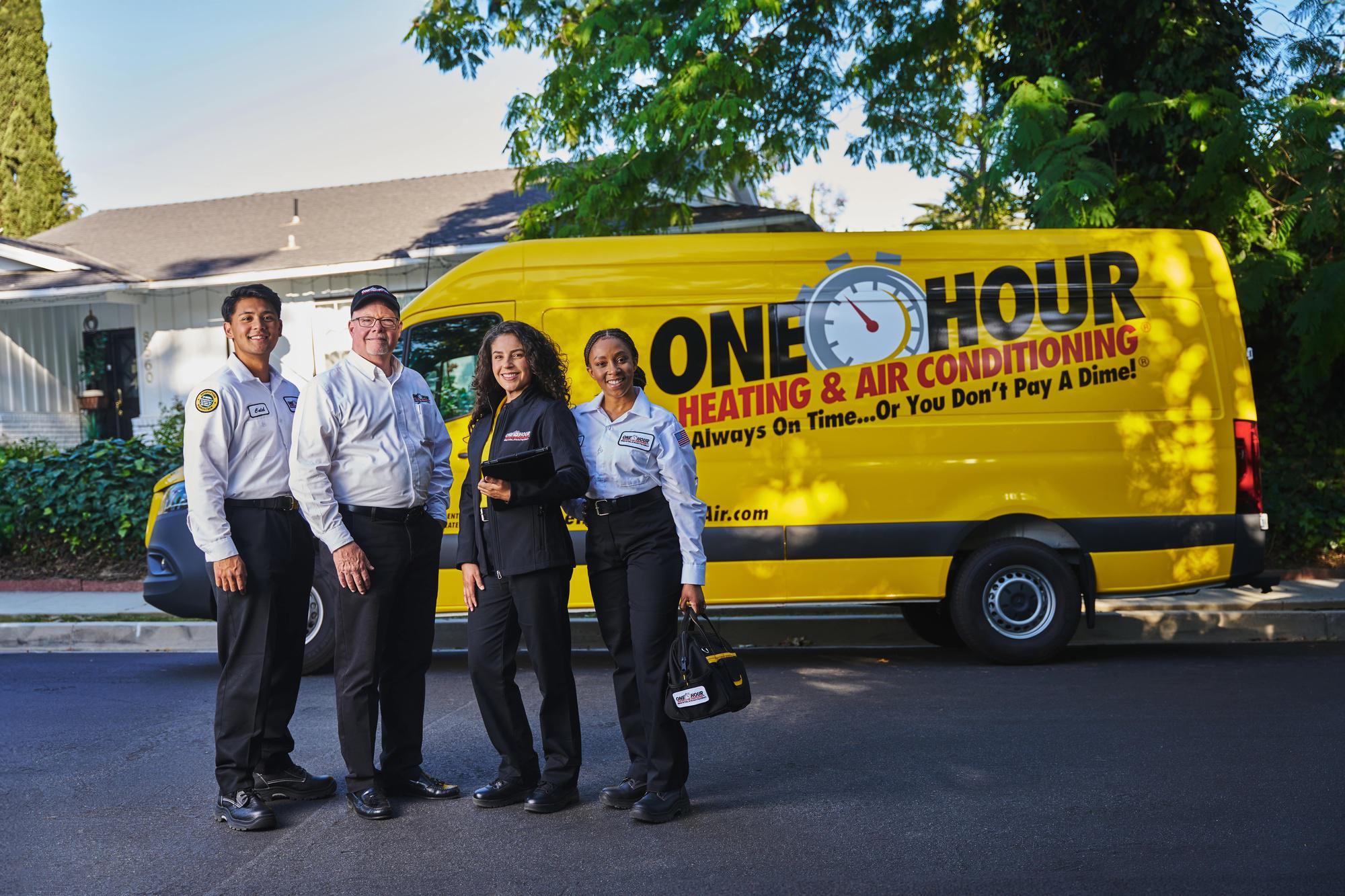 Team members in front of One Hour Van