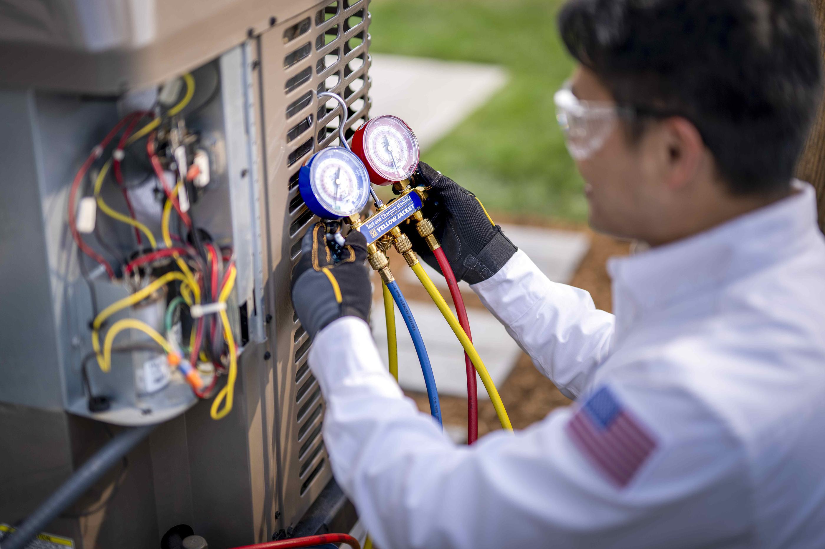 Close Up of HVAC Maintenance on AC Unit