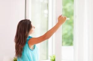 Lady cleaning the window 