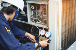 HVAC technician testing an HVAC unit