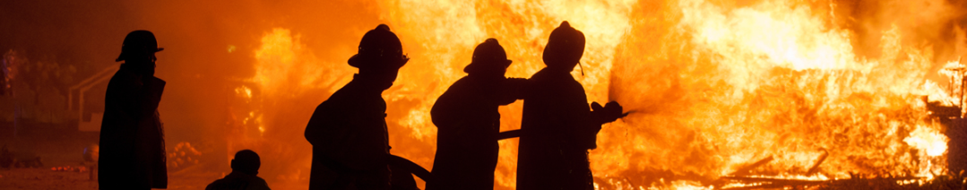 fire fighters spraying water on fire