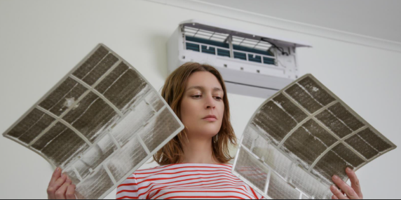 woman inspecting two different sheets