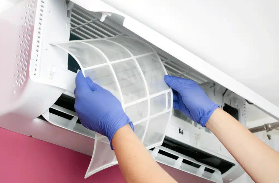 person changing out air filter in Kingman, AZ