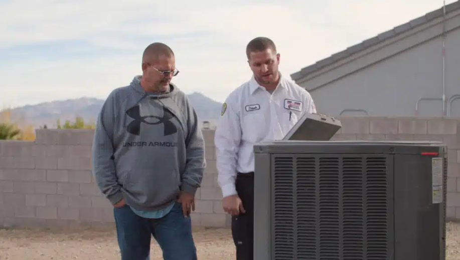 One Hour Air Conditioning & Heating of Kingman tech talking to customer