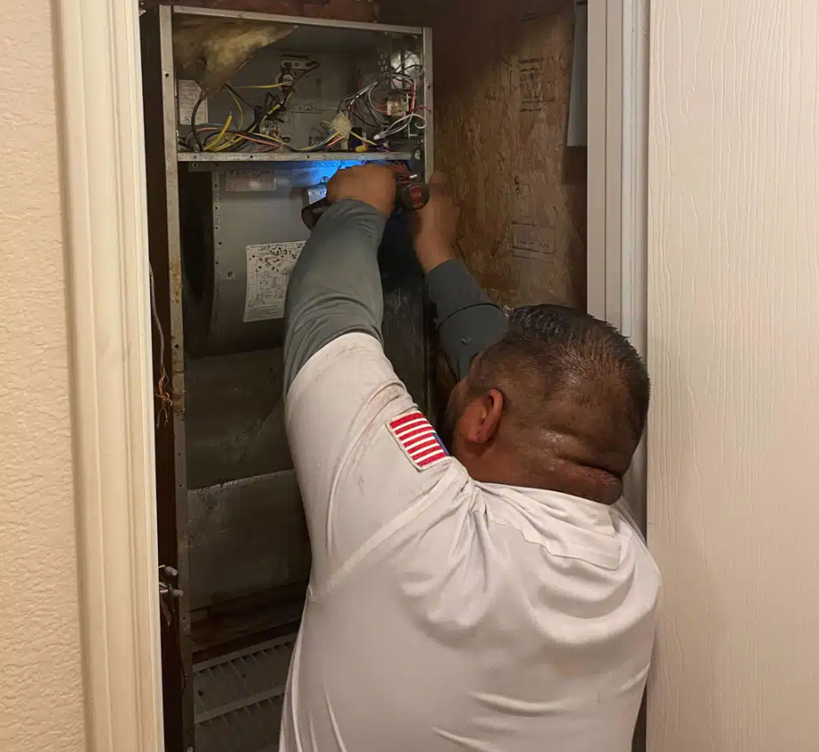 One Hour Air Conditioning & Heating of Prescott technician working on HVAC unit