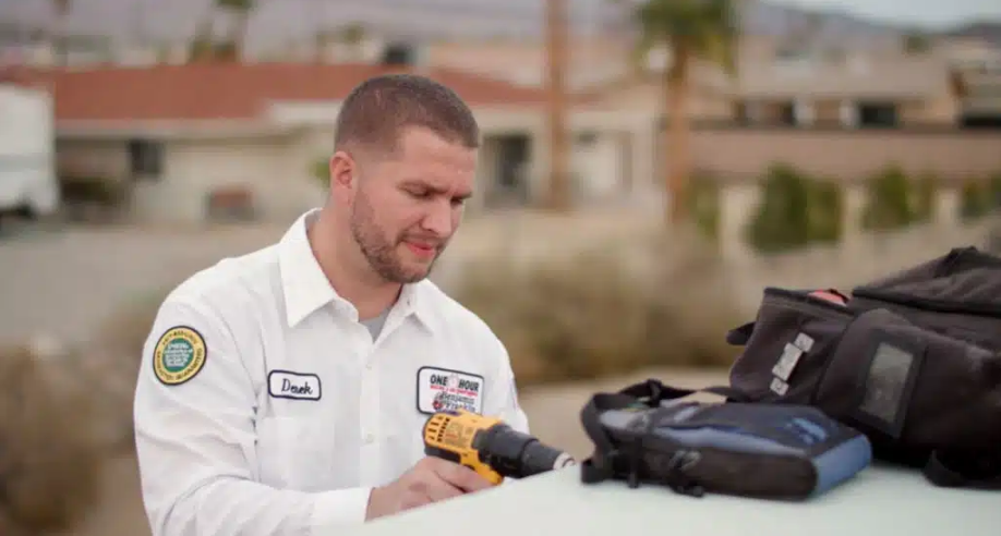 One Hour Air Conditioning & Heating of Kingman tech working on unit