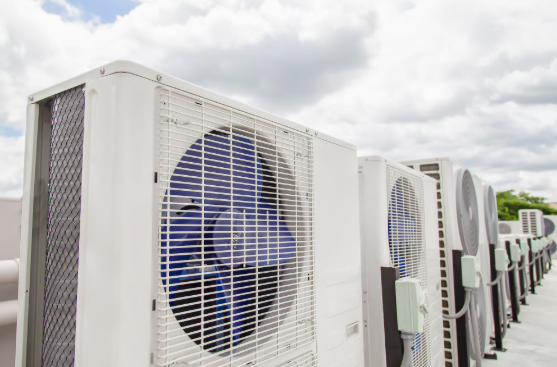 Why are air conditioners installed on the roof in Phoenix homes?