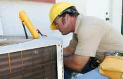 HVAC technician inspecting HVAC system