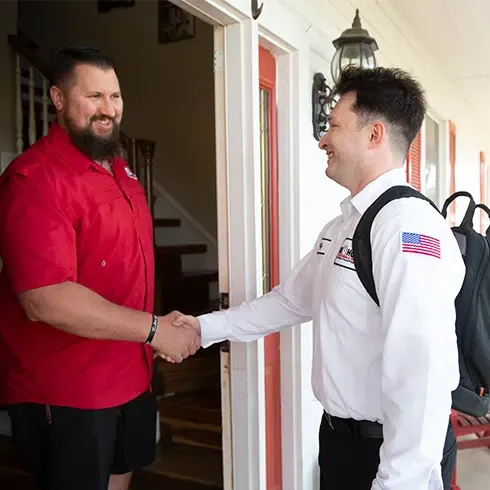 One Hour of Kingman Technician shaking hands with owner